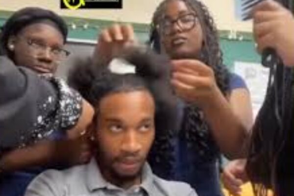 students unbraiding teachers hair fired