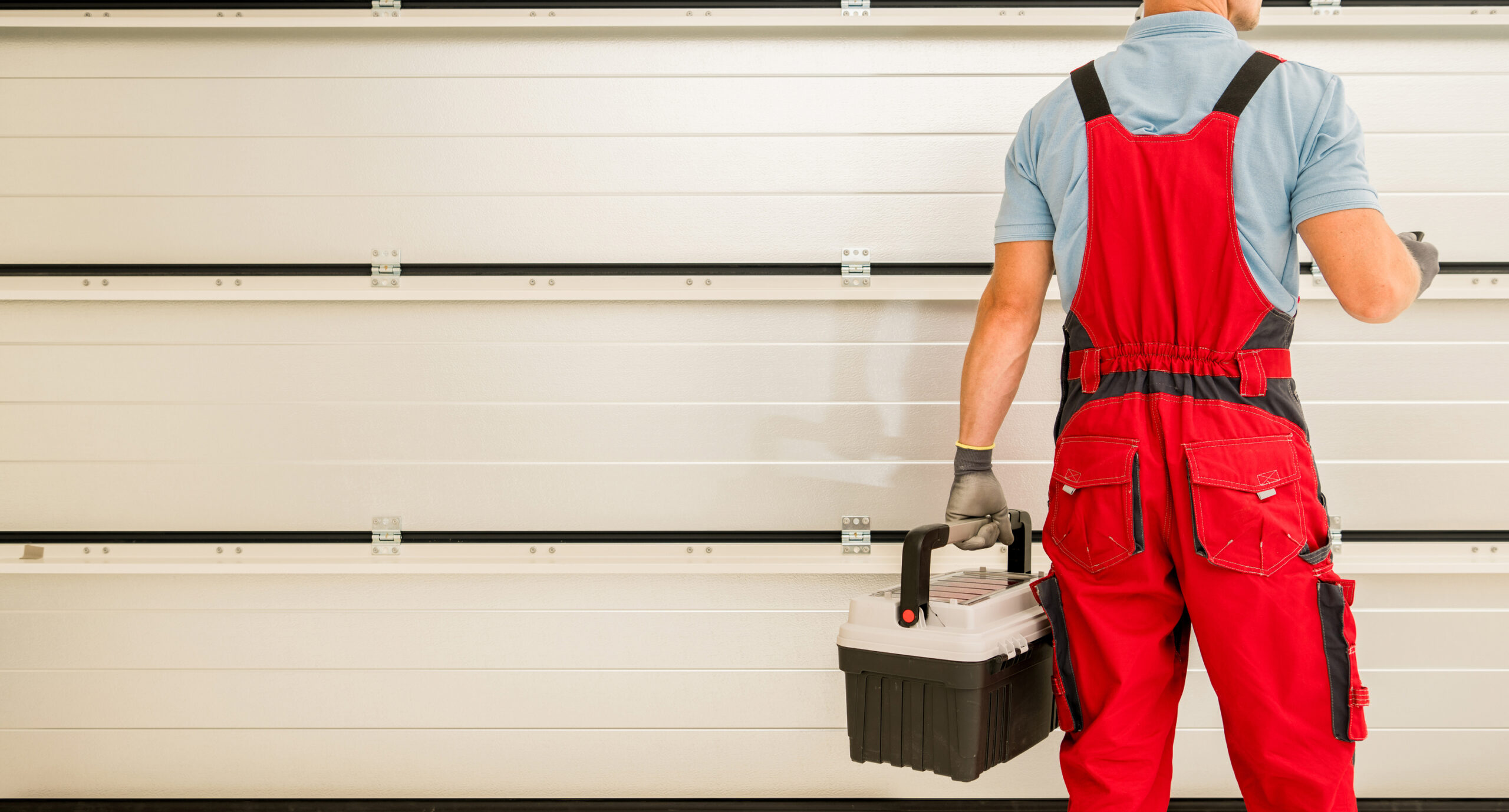 Garage Gate Installer Finishing His Job